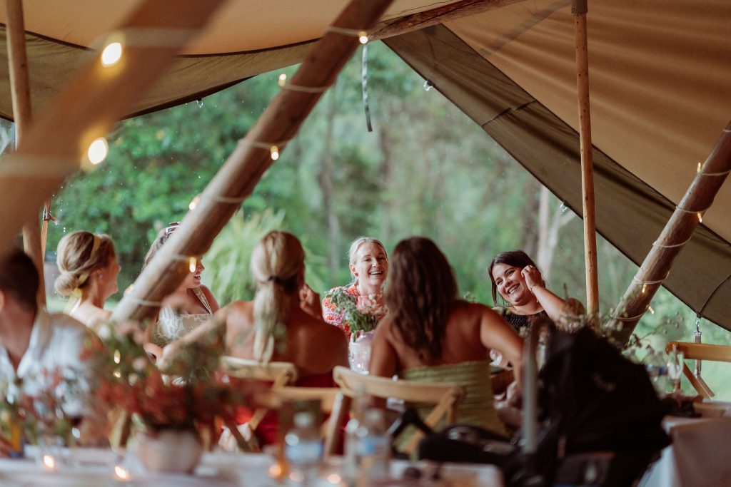 warm and dry under tipi on rainy wedding day